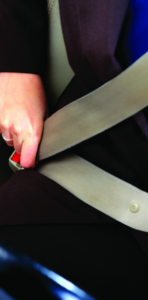 Person buckling seatbelt