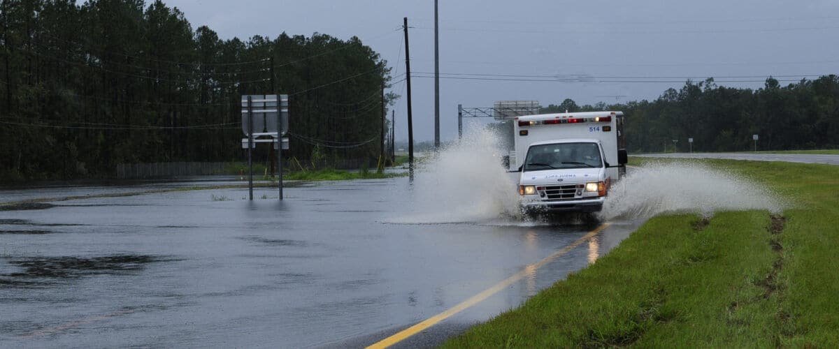FEMA 37595 Ambulance on a flooded road in Florida 1200x500