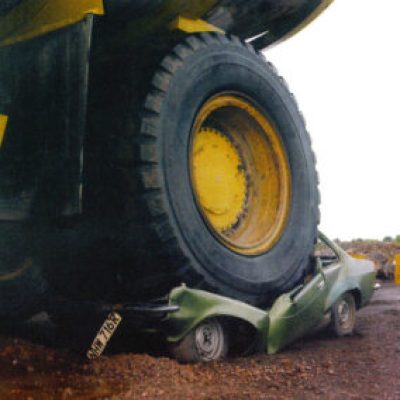 634px Haul truck backed over a parked vehicle 300x284
